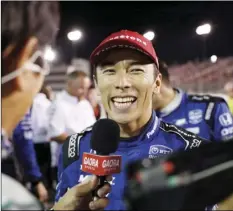  ?? PHOTO/JEFF ROBERSON ?? In a Aug. 24 file photo, Takuma Sato smiles as he is interviewe­d after winning the IndyCar auto race at World Wide Technology Raceway in Madison, Ill. AP