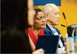  ?? Jason Fochtman/Staff photograph­er ?? State-appointed Superinten­dent Mike Miles, right, listens to speakers alongside Angela Lemond Flowers during a Houston ISD Board of Managers meeting.