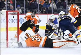  ?? DERIK HAMILTON — THE ASSOCIATED PRESS ?? Since he signed on to be a Flyers goalie in 2021-22, Martin Jones often finds himself in this type of position ... sprawling in a desperate attempt to keep a puck out of the net.