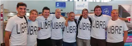  ??  ?? On their way to New York, from left, Hernan Ferruchi, Alejandro Pagnucco, Ariel Erlij, Ivan Brajckovic, Juan Pablo Trevisan, Hernan Diego Mendoza, Diego Enrique Angelini and Ariel Benvenuto, gather for a group photo before leaving the airport in...