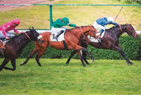  ?? Rex Features ?? Cloth of Stars, with Mickael Barzalona in the saddle, beats Zarak, the mount of Christophe Soumillon, to win the Group 1 Prix Ganay in Saint Cloud, France, in May. The Godolphin-owned colt will hope to build on that success in Sunday’s big race.