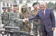  ?? PTI ?? Lt Gen Zhou Xiaozhou shakes hands with Indian Ambassador Ashok K Kantha at Kunming Military Academy in Yunnan on Monday.