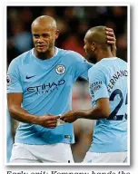  ?? REUTERS ?? Early exit: Kompany hands the armband to Fernandinh­o