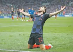  ?? FRANK AUGSTEIN/ASSOCIATED PRESS ?? Croatia’s Josip Pivaric celebrates a win over England at the World Cup in Moscow.