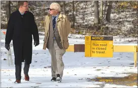  ?? Canadian Press photo ?? M.P.P. Monte McNaughton, left, and John Fraser walk from the entrance to Pinery Provincial Park near Grand Bend, Ont. on Friday.