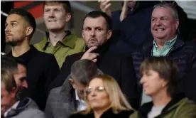  ?? Photograph: Andrew Matthews/PA ?? Nathan Jones (centre) watches Southampto­n’s Carabao Cup tie at home to Sheffield Wednesday from the stands on Wednesday.
