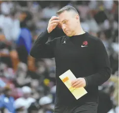 ?? REBECCA BLACKWELL / AP PHOTO ?? Toronto Raptors head coach Darko Rajakovic suffered
through a difficult first year at the helm.