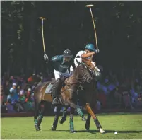  ?? STAFF FILE PHOTO ?? Bendabout Farm polo team member Bobby Connors, far right, fights for control of the ball from Aiken, S.C., player Owen Rinehart during a 2013 match in McDonald, Tenn.