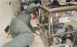  ??  ?? Nasa’s 3D printer gets hooked up while orbiting the Earth.