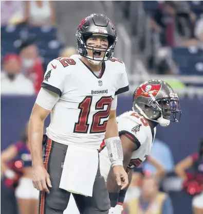  ?? ERIC CHRISTIAN SMITH/AP ?? Tom Brady and the Buccaneers will open their championsh­ip defense at home Thursday night against the Cowboys.