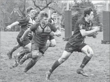  ?? CAROLE MORRIS-UNDERHILL ?? Will Keating wasn’t about to stop on his way to scoring a try for King’s-Edgehill School April 26.