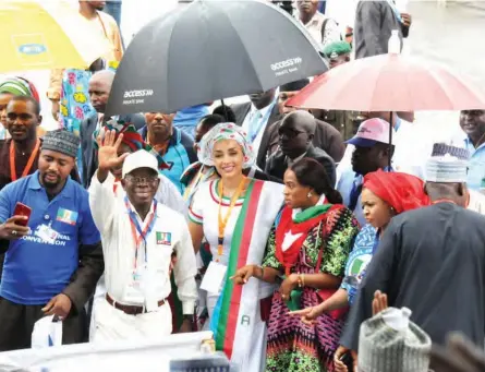  ??  ?? APC National Chairmansh­ip Aspirant, Comrade Adams Oshiomhole (2nd left) with his wife Lara, during their arrival for the party’s national convention in Abuja yesterday PHOTO: NAN