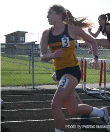  ?? Photo by Patrick Gunsett ?? Macie Hirschy finished fifth in the 100 M hurdles and sixth in the 300 M hurdles to help South Adams win the team title Monday at Bluffton.