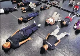  ??  ?? After an hour of intense hip-hop dance instructio­n, students cool down. Principal Anniece Gentry is aggressive about gaining private partners to enrich the students’ experience. Other partnershi­ps include Corky’s BBQ, New Hope Baptist Church and...