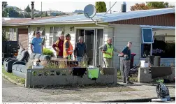  ?? JOHN HAWKINS/STUFF ?? Mataura residents begin the clean up after the town was hit by flooding.