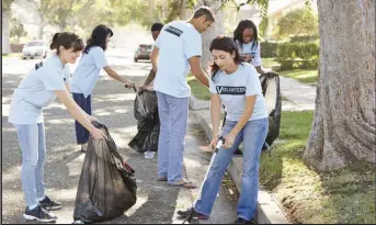  ??  ?? Group events such as a litter pick-up can be organized as a fund-raiser to make possible a charitable donation. Articles on this page explore decision-making when it comes to choosing charities and your approach to giving.