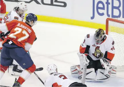  ?? ALAN DIAZ/THE ASSOCIATED PRESS ?? Ottawa Senators goalie Craig Anderson stops a shot by Florida Panthers' Nick Bjugstad during NHL action Sunday in Sunrise, Fla. Anderson was stellar with 27 saves in a 2-1 victory.