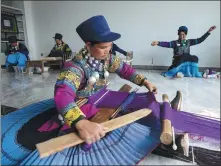  ?? JIANG HONGJING / XINHUA ?? Women work at an embroidery workshop at a relocation community in Butuo county, Liangshan Yi autonomous prefecture, Sichuan province, on Sept 14.