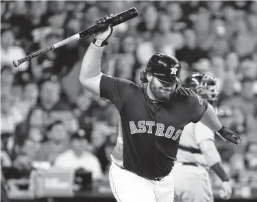  ?? Photos by Brett Coomer / Staff photograph­er ?? The Astros’ Tyler White displays his frustratio­n after striking out, which he did twice in the 4-1 loss.