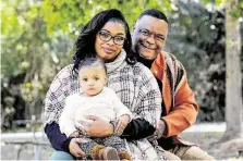  ?? Michael Wyke / Contributo­r ?? Genia Robinson, whose former boyfriend physically abused her even when she was pregnant, poses with her husband, Michael Mamou, and 1-year-old daughter, Amia Estes, at Jesse Jones Park.
