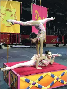  ?? Photo by Ernest A. Brown ?? The Mongolian Contortion­ists practice their routine on Friday at the Dunkin’ Donuts Center.