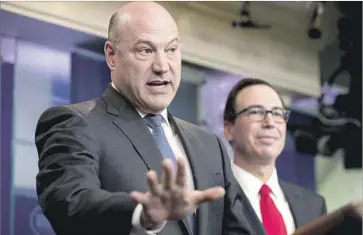  ?? Andrew Harnik Associated Press ?? GARY COHN, National Economic Council director, presented the plan at a White House briefing with Treasury Secretary Steven T. Mnuchin, right. “This isn’t going to be easy,” Cohn said. “Doing big things never is.”