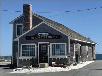  ?? Moira MCCartHy / BoSton Herald ?? SEA FARE: What would a beach visit be without lobster? The Lobster Pound in Plymouth has outdoor seating for dining with a view.