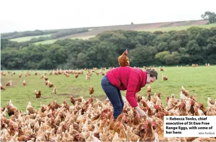  ?? John Portlock ?? Rebecca Tonks, chief executive of St Ewe Free Range Eggs, with some of her hens