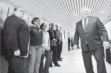  ?? NATHAN DENETTE THE CANADIAN PRESS ?? Ontario Progressiv­e Conservati­ve Leader Doug Ford meets with Etobicoke General Hospital staff during a campaign stop in Toronto on Thursday.