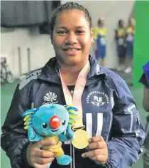  ??  ?? Eileen Cikamatana after winning gold at the Commonweal­th Games in Gold Coast