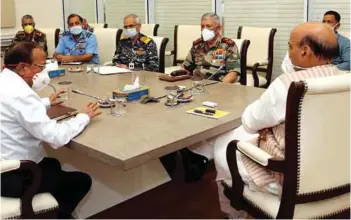  ?? PHOTOGRAPH: PIB ?? Defence Minister Rajnath Singh holding a meeting with the National Security Advisor, the Chief of Defence Staff and the Tri-Service Chiefs, in New Delhi on May 1, 2020