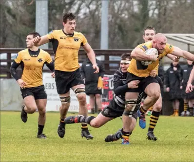  ?? Pictures: Brendan Hurley ?? Ashbourne’s Simon Deevy is tackled by Laurence Steen of Dundalk.