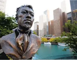  ?? BRIAN CASSELLA/CHICAGO TRIBUNE ?? A statue of Jean Baptiste Point DuSable, a Haitian-born trader known as the founder of Chicago,stands in downtown Chicago.