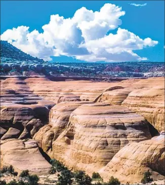  ?? Stephen Trimble ?? SANDSTONE DOMES in the Labyrinth Canyon-Gemini Bridges corridor west of Moab. Utah’s governor predictabl­y calls a proposal to close some vehicle routes here “completely unacceptab­le.”