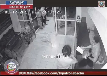  ??  ?? Chief Inspector Melvin Madrona is shown in a closed-circuit television video, aired by ABS-CBN, beating up a man at the Fairview police station on March 17 as his colleagues look on. The man later filed charges against him.