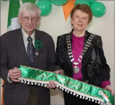  ??  ?? Sean Doyle, Grand Marshal for the Enniscorth­y parade, receives the sash from Cllr Kathleen Codd-Nolan.