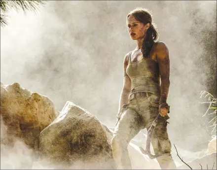  ?? Associated Press photos ?? This image released by Warner Bros. Pictures shows Alicia Vikander in a scene from “Tomb Raider.”