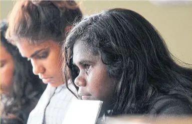  ?? KATRINA CLARKE PHOTOS ?? Jodie Palipuminn­i, an MITS student from Milikapiti, listens to a presentati­on during a class trip to Melbourne. MITS attempts to address gaps in an education system some say leaves Indigenous students at a distinct disadvanta­ge.