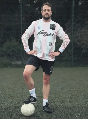  ?? PHOTOGRAPH­S: MARTIN GODWIN/ THE GUARDIAN ?? The Guardian’s Will Dean puts the Acne football shirt through its paces on the pitch