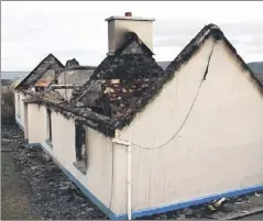  ?? Photo by John Reidy ?? The shell of the cottage at Ardoughter outside Ballyduff that was burned down by rampaging thugs at the weekend.