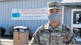  ?? BILL JONES / DAILY SOUTHTOWN PHOTOS ?? Pfc. Landon Luangsomkh­am was one of the workers at the South Suburban College vaccinatio­n site to receive a gift bag.