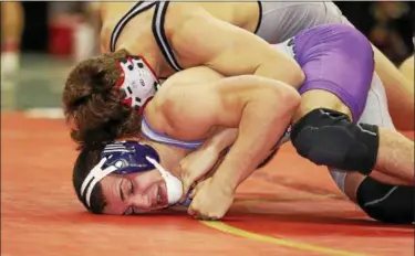  ?? JOE MAIORANA — IMPACTACTI­ONPHOTOS ?? Keystone’s Garrett Coe, bottom, competes at the state wrestling tournament.