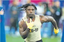  ?? DARRON CUMMINGS/THE ASSOCIATED PRESS ?? Southern Mississipp­i running back Frank Gore Jr. runs a drill at the NFL scouting combine on Saturday in Indianapol­is. Gore is the son of former Pro Bowler Frank Gore.