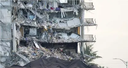  ?? AP FILE ?? The remnants of the Champlain Towers South condo building are shown weeks after the June 24, 2021, collapse in Surfside, Florida.