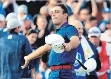  ?? ANDREW REDINGTON GETTY IMAGES ?? Francesco Molinari of Europe celebrates on the 14th hole during the afternoon foursome matches of the 2018 Ryder Cup at Le Golf National.