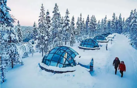  ??  ?? Kakslautta­nen’s glass igloos offer front row seats to nature’s most spectacula­r light shows – the Aurora Borealis.