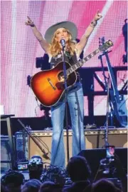  ?? PHOTO BY ED RODE/INVISION/AP ?? Sheryl Crow performs at the “Love Rising” concert Monday at the Bridgeston­e Arena in Nashville.