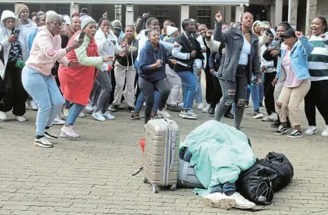  ?? Picture: UVIWE JARA ?? STAY AWAY: Ikhala TVET College students protesting and singing at the college premises, calling for the college to reverse the suspension of their SRC chairperso­n.