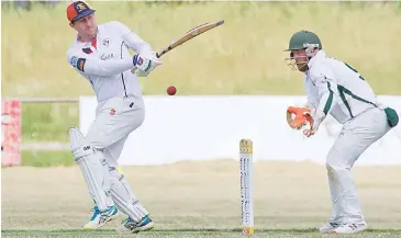  ??  ?? Longwarry’s Scott Kelly plays a ball down the leg side against Garfield-Tynong on Saturday afternoon.