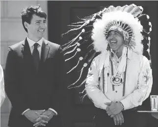  ?? SEAN KILPATRICK/THE CANADIAN PRESS ?? Prime Minister Justin Trudeau and Perry Bellegarde, national chief of the Assembly of First Nations, celebrate National Indigenous Peoples Day in Ottawa on Wednesday.